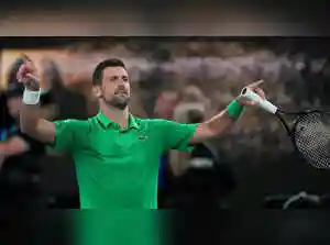 Novak Djokovic moves closer to a record Australian Open title. He advanced after Lorenzo Musetti retired injured while leading. Iga Swiatek's Grand Slam bid