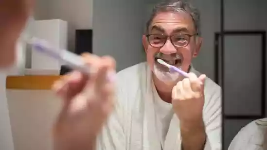 Do you often crawl into bed too tired to brush your teeth, promising yourself you'll do better tomorrow? Many of us tend to overlook oral hygiene until problems like bad breath, cavities, or gum sensitivity force us to take notice. Yet, simple daily habits can make a lasting difference—not just for your teeth and gums, but for the overall health of your oral microbiome.Do you often crawl into bed too tired to brush your teeth, promising yourself you'll do better tomorrow? Many of us tend to overlook oral hygiene until problems like bad breath, cavities, or gum sensitivity force us to take notice. Yet, simple daily habits can make a lasting difference—not just for your teeth and gums, but for the overall health of your oral microbiome.<strong>Also Read | </strong>Feeling like a walking balloon? NHS surgeon explains what causes bloating, shares simple hacks to ease discomfortDr Karan Rajan, a UK-based NHS surgeon and popular health content creator, has shared simple yet effective oral hygiene tips to support a balanced and healthy oral microbiome. In an Instagram video posted on October 5, the surgeon shares seven simple strategies that help balance your oral microbiome, reduce harmful bacterial buildup, and protect against tooth decay and other oral health issues.