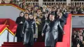 North Korean leader Kim Jong Un donned a matching jacket with his daughter, known as Kim Ju Ae, at a military parade, intensifying speculation that she is