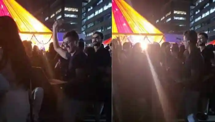 Employee Dances With Laptop In Hand At Diwali Office Party