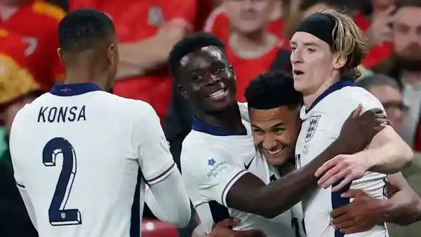 England delivered a commanding 3-0 victory over Wales in a one-sided international friendly at Wembley Stadium. Under Thomas Tuchel's leadership, the Three Lions showcased their attacking prowess and defensive solidity, with Morgan Rogers, Ollie Watkins, and Bukayo Saka scoring goals. On the other hand, Craig Bellamy's spirited Wales side struggled to match England's clinical edge.England delivered a commanding 3-0 victory over Wales in a one-sided international friendly at Wembley Stadium. Under Thomas Tuchel's leadership, the Three Lions showcased their attacking prowess and defensive solidity, with Morgan Rogers, Ollie Watkins, and Bukayo Saka scoring goals. On the other hand, Craig Bellamy's spirited Wales side struggled to match England's clinical edge.<h4>First half: England surge ahead</h4>England seized control early and struck twice in the opening 12 minutes, dismantling Wales' resolve. At the three-minute mark, Marc Guehi's corner delivery found Morgan Rogers unmarked for a tap-in as he claimed his first goal for England. In the 11th minute, Ollie Watkins pounced, registering a 2-0 lead. Wales struggled in Bellamy's high press. Bukayu Saka sealed the third goal for the team with Ezri Konsa Ngoyo's assist.