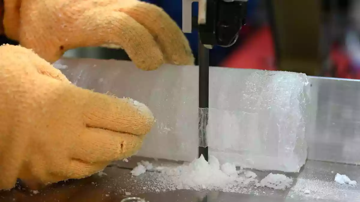 Dressed in an orange puffer jacket, Japanese scientist Yoshinori Iizuka stepped into a storage freezer to retrieve an ice core he hopes will help experts