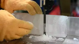 Dressed in an orange puffer jacket, Japanese scientist Yoshinori Iizuka stepped into a storage freezer to retrieve an ice core he hopes will help experts