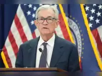 A Reuters poll of economists indicates the Federal Reserve will hold interest rates steady through May, with a cut expected in June