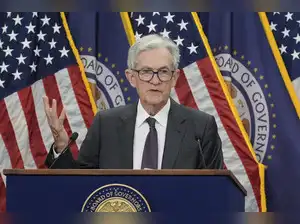 Federal Reserve officials prioritized inflation concerns over potential job losses at their July meeting, holding rates steady. They debated the uncertain impact of President Trump's tariffs on inflation, acknowledging some price increases but awaiting clearer data. While some worried about consumer burden and persistent inflation, others saw a temporary price hike, fueling dissent for a rate cut.