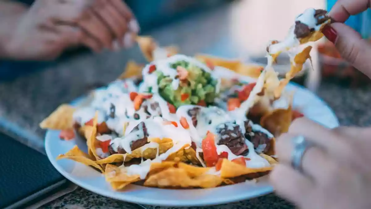 Perfect for sharing, nachos are a universally loved food that can be made in multiple ways and with many variations of toppings. As it is National Nachos Day
