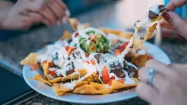 Perfect for sharing, nachos are a universally loved food that can be made in multiple ways and with many variations of toppings. As it is National Nachos Day
