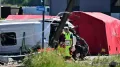 Two children, aged 12 and 15, and two adults have been killed in a collision between a train and a school minibus in Buggenhout, northern Belgium