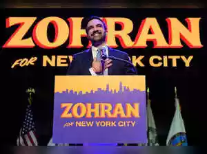 Zohran Mamdani's mayoral campaign in New York City featured striking blue and orange signs. The design, inspired by Bollywood posters and local businesses