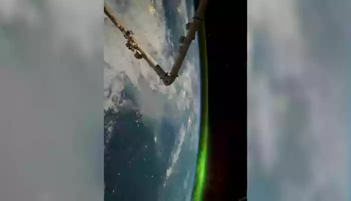 The video, captured from space, showcases the Aurora Borealis like never before. From thousands of kilometers above, the lights shimmer and twist over the