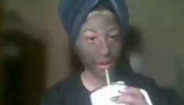 In the viral video, the woman appears calmly seated in front of her screen, actively participating in what looks like a routine virtual meeting