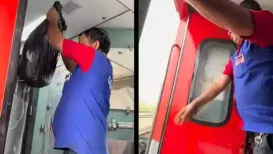 A Railways worker has been removed from service after he was filmed throwing garbage from a moving train onto the tracks. Footage of the worker