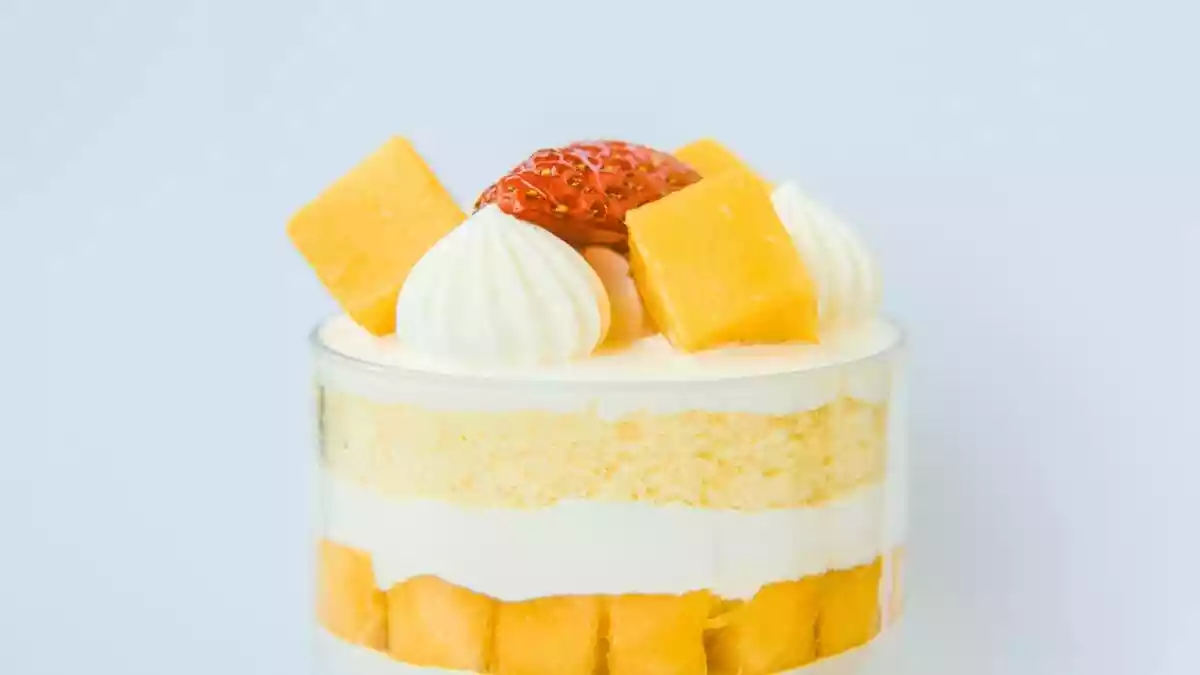 Turn a classic, creamy tiramisu into a refreshing summer treat by swapping coffee for juicy mango and layering it with fresh fruit and light mascarpone cream
