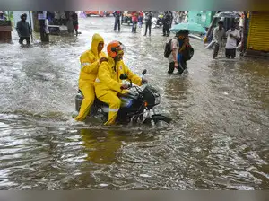Heavy rains caused flooding in Thane and Palghar, Maharashtra. Houses were submerged, and walls collapsed. Villages were cut off. A man was injured in Thane. Ghodbunder Road was closed. People were rescued from a submerged SUV. Authorities are on high alert. Residents in flood-prone areas are asked to relocate. Emergencies should be reported quickly.