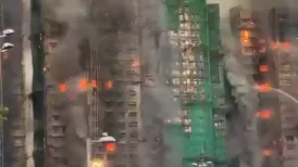 Four people were killed after a massive fire engulfed several high-rise towers of a residential complex in Hong Kong's northern Tai Po district