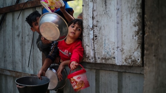 Hossam Wafi was among 31 people killed by Israeli fire while trying to reach a food distribution site the previous day. Cries of grief echoed across southern Gaza's Nasser Hospital Monday as dozens came to mourn Hossam Wafi, after the father of six was killed while attempting to get supplies to feed his family.