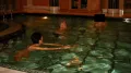 There is a photo that shows Bill Clinton taking a night-time swim alongside Ghislaine Maxwell, the British socialite now convicted of sex trafficking
