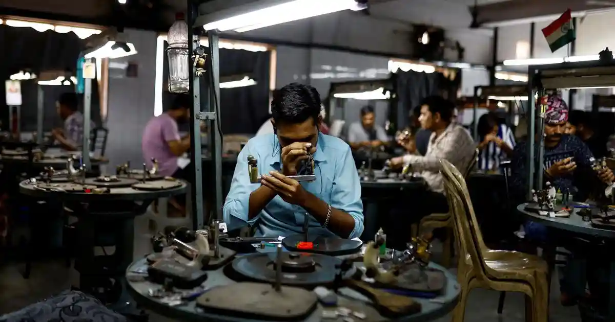The narrow lanes of Varaccha in Surat are crammed with buildings that are connected to each other. Most of these have several small rooms in which workers sit