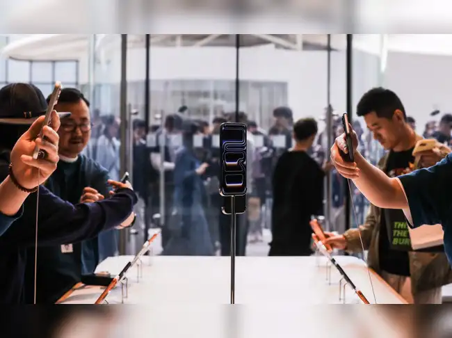 Hundreds of people lined up at Apple's flagship store in Beijing on the launch day of the iPhone 17 on Friday in a sign that sales of the series are off to a promising start in the world's second-largest economy.<br><br> Among the roughly 300 people that arrived in the morning at Apple's store in downtown Sanlitun to pick up phones ordered online was Shuke Wang, 35, who said he purchased the Pro Max model, priced from 9,999 yuan ($1,406) in China and pegged by analysts to be the best selling model in the 17 series.<br><br> 