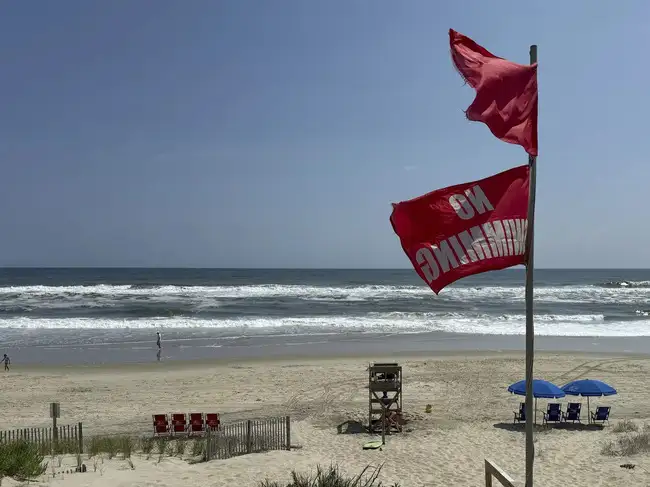 Hurricane Erin, while not expected to make landfall in the US, is triggering dangerous rip currents and coastal flooding along the East Coast. North Carolina's Outer Banks are under coastal flood advisory with evacuation orders in place. Beachgoers from Florida to Canada are urged to heed warnings due to life-threatening surf conditions expected to persist for several days.