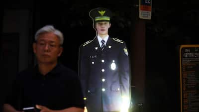 Imagine walking the streets of Seoul, the vibrant capital of South Korea, when suddenly a police officer appears before you. “In case of an emergency, police will be dispatched in real time. CCTV is installed here,