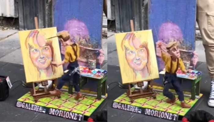 In a viral video on Instagram, a street performer is using a marionette and guides the puppet's tiny hands to hold a paintbrush and create intricate paintings. A viral video on Instagram has left social media users in awe after showcasing a street artist creating a painting in a truly unique way. The video, which has already garnered more than 5.2 million views and thousands of comments, features the incredible skills of a talented artist who is gaining wide attention for his unusual technique.