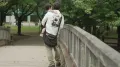 On a weekday afternoon in Japan, John Deng stands near the playground, listening to other children play and laugh. His own son and daughter are nowhere in