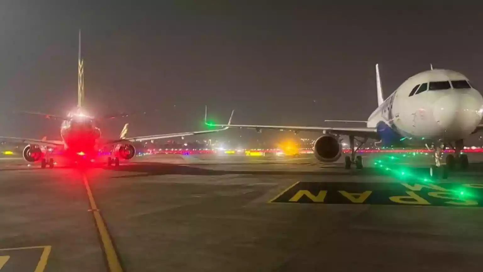 India's civil aviation regulator has launched an investigation after the wingtips of two passenger aircraft briefly came into contact on a runway at Mumbai