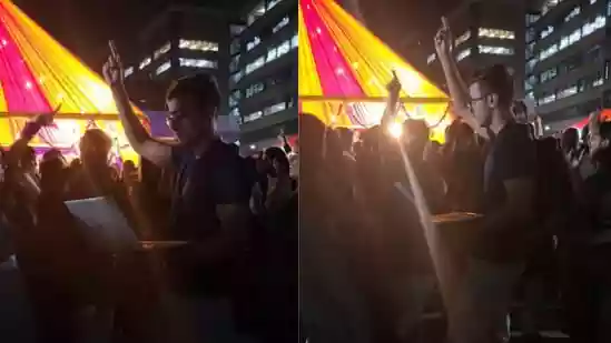 Indian employee dances at office Diwali party while working