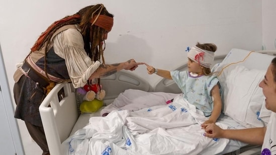 Johnny Depp dressed up as his Pirates of the Caribbean character, Jack Sparrow, and visited a children's hospital in Madrid. For a generation of moviegoers, Johnny Depp is Captain Jack Sparrow. He may have made some critically acclaimed and commercially successful films, but it was Pirates of the Caribbean that made him a global superstar. This past week, Johnny returned to his iconic role, albeit not for the camera. The actor dressed up as the lovable pirate and surprised kids at Nino Jesus University Children's Hospital in Madrid. (Also read: Fans ‘barely’ recognise Johnny Depp after dramatic silver fox transformation)