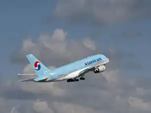 Korean Air has placed a monumental $50 billion order for 103 Boeing aircraft and GE Aerospace engines, coinciding with South Korean President Lee Jae Myung's visit to Washington. This historic deal, the airline's largest ever, includes 787s, 777s, and 737s, bolstering U.S. aerospace exports and supporting Korean Air's expansion to new destinations while integrating operations with Asiana Airlines.