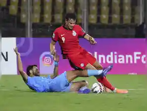 Lallianzuala Chhangte's 14th minute strike was cancelled out by Song's equalizer in the 44th minute, and then he struck what proved to be the winner, in the 58th minute as India were left to rue many missed chances. The two teams were locked 1-1 at the half-time break at the Jawahar Lal Nehru Stadium, having played a 1-1 stalemate in the first leg in Singapore on October 9.Lallianzuala Chhangte's 14th minute strike was cancelled out by Song's equalizer in the 44th minute, and then he struck what proved to be the winner, in the 58th minute as India were left to rue many missed chances. The two teams were locked 1-1 at the half-time break at the Jawahar Lal Nehru Stadium, having played a 1-1 stalemate in the first leg in Singapore on October 9.MARGAO: India failed to qualify for the 2027 AFC Asian Cup after going down 1-2 to Singapore who rallied to humble the hosts with a brace from Korea-born attacking mid-fielder Song Ui-young in the third round qualification match here on Tuesday.<br><br>Lallianzuala Chhangte's 14th minute strike was cancelled out by Song's equalizer in the 44th minute, and then he struck what proved to be the winner, in the 58th minute as India were left to rue many missed chances.<br><br>The two teams were locked 1-1 at the half-time break at the Jawahar Lal Nehru Stadium, having played a 1-1 stalemate in the first leg in Singapore on October 9.<br><br>In the day's other Group C match, Hong Kong and Bangladesh shared the spoils after a 1-1 draw in Hong Kong, a result that did not help India's cause who entered the game with two points from three matches.<br><br>India were the dominant team in the first half and enjoyed long spells of possession, and it was appropriate that the Blue Tigers scored the opening goal in front of a lively home crowd.<br><br>Chhangte received the ball some distance away from the edge of the box and unleashed a screamer with his left foot that beat the Singapore goalkeeper on its way to the back of the net.<br><br>However, Song had other ideas as he struck twice in ether side of the break to dash Indian hopes.<br><br>Just before the interval, Singapore struck back against the run of play courtesy Song, who found space inside the Indian box and kept his composure to level the score at 1–1, the equaliser leaving the Indian players distraught for they were the ones dictating play for most parts of the first half.<br><br>On resumption, the visitors looked much sharper and more confident thanks to that equali