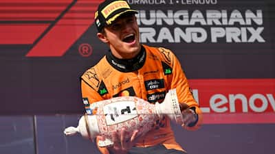 Lando Norris held off a relentless charge from teammate Oscar Piastri to claim victory at the Hungarian Grand Prix on Sunday, continuing McLaren's remarkable run of form and marking a landmark 200th Formula One win for the team. With Norris and Piastri locking out the top two positions for a fourth consecutive race, McLaren's resurgence underlined their growing status as the team to beat in 2025.