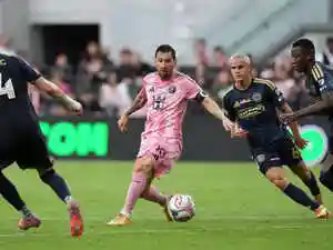 Lionel Messi left Inter Miami's match early, sparking worries about his fitness for the World Cup. He reached for his hamstring before exiting