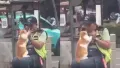 The clip, viral on X (formerly Twitter), shows the man gently interacting with the cat. Instead of shooing it away, the officer engages playfully