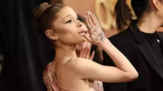 A court in Singapore has sentenced an Australian man to nine days in prison for grabbing Hollywood star Ariana Grande at a movie premiere. Johnson Wen, 26