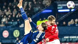 Scotland secured their spot at the FIFA World Cup 2026 with a commanding victory over a 10-man Denmark on Wednesday, as the Scots achieved a 4-2 win at the