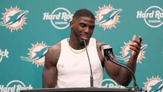 Miami Dolphins wide receiver Tyreek Hill is drawing attention off the field as his divorce from Keeta Vaccaro continues amid new dating rumors. Hill was recently seen with an unidentified woman at a resort, sparking questions about his personal life. Photos show Hill and the woman laughing on water slides, holding hands, and leaving the property together, leading to speculation about a possible relationship, according to The Times Of India.