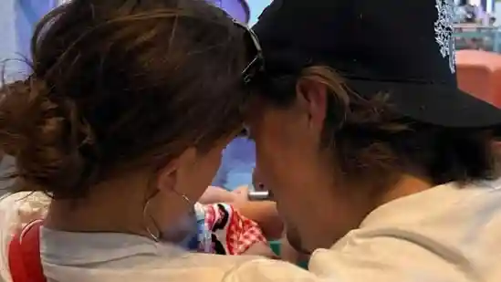 Millie Bobby Brown has shared her first photo as a new mom, revealing a glimpse of her adopted baby girl. A post shared by Millie Bobby Brown (@milliebobbybrown) The image, uploaded as part of a series of photos, went with the caption “my t swift october.”Millie Bobby Brown has shared her first photo as a new mom, revealing a glimpse of her adopted baby girl.A post shared by Millie Bobby Brown (@milliebobbybrown)The image, uploaded as part of a series of photos, went with the caption “my t swift october.”The Stranger Things star, who married Jake Bongiovi, 23, in May 2024, confirmed in August that they had adopted a daughter.“This summer, we welcomed our sweet baby girl through adoption,” Brown wrote in her announcement. “We are beyond excited to embark on this beautiful next chapter of parenthood in both peace and privacy. And then there were three. Love, Millie and Jake Bongiovi.”In the new picture, the couple is seen smiling at their baby, whose tiny hand is visible in the frame.