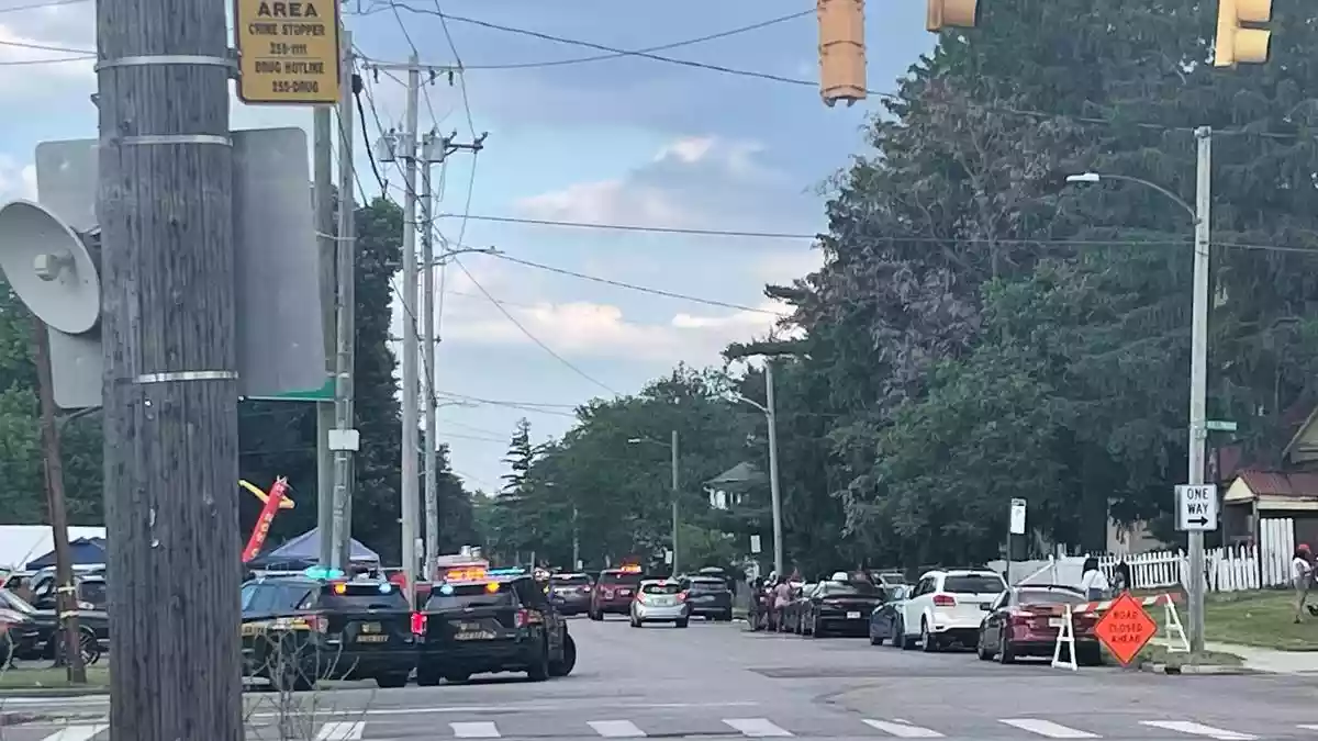 A shooting near a community festival in Toledo, Ohio, wounded at least 12 people, and police said a search for the suspects was ongoing following an outbreak