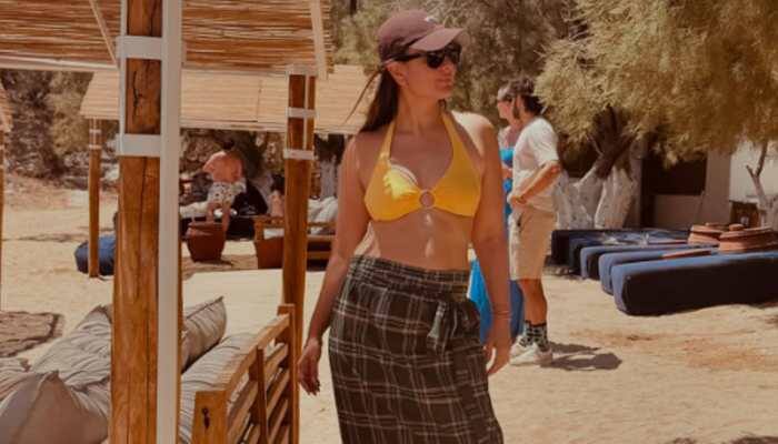 New Delhi: Bollywood stunner Kareena Kapoor Khan amped up her Instagram game with recent vacay pictures from Greece. The diva shared her photo dump in a bright mustard bikini top paired with a chequered print lungi skirt, looking absolutely gorgeous.