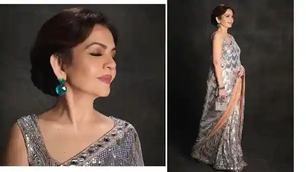 Nita Ambani, the wife of Mukesh Ambani, is not only one of the richest women across India but also one with exceptional collection of intricately designed and valuable jewellery pieces. Her emerald earrings were the show-stopper at the renowned designer Manish Malhotra's grand Diwali bash in Mumbai.Nita Ambani, the wife of Mukesh Ambani, is not only one of the richest women across India but also one with exceptional collection of intricately designed and valuable jewellery pieces. Her emerald earrings were the show-stopper at the renowned designer Manish Malhotra's grand Diwali bash in Mumbai.Always turning heads with her timeless style, luxury and precious accessories, this time Nita Ambani chose to pair silver sequin chevron saree with huge heart-shaped Colombian emerald earrings. She added some signature detail to custom Manish Malhotra attire with diamond bracelet and a rare Hermès Kellymorphose High Jewellery miniature bag. Nita completed her look with sleeveless U-neck blouse, a side-parted chignon bun, kohl-rimmed eyes, natural-dewy makeup, and glossy pink lips for the perfect festive glow. The chairperson and founder of the Reliance Foundation boasts, who boasts a personal wealth of around ₹2,340 crore to ₹2,510 crore according to a DNA India report, looked gracious and glamorous.