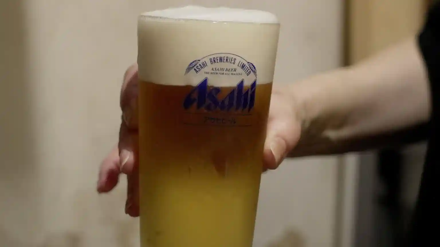 Only four bottles of Asahi Super Dry beer are left on the shelves of Ben Thai, a cosy restaurant in the Tokyo suburb of Sengawacho. Its owner, Sakaolath Sugizaki, expects to get a few more soon, but she says her supplier is keeping the bulk of its stock for bigger customers.Only four bottles of Asahi Super Dry beer are left on the shelves of Ben Thai, a cosy restaurant in the Tokyo suburb of Sengawacho.Its owner, Sakaolath Sugizaki, expects to get a few more soon, but she says her supplier is keeping the bulk of its stock for bigger customers.That's because Asahi, the maker of Japan's best-selling beer, was forced to halt production at most of its 30 factories in the country at the end of last month after being hit by a cyber-attack.While all of its facilities in Japan - including six breweries - have now partially reopened, its computer systems are still down.That means it has to process orders and shipments manually - using pen, paper and fax machines - resulting in much fewer shipments than before the attack.