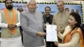 Bihar Chief Minister Nitish Kumar has stoked a political row after he was seen in a video, pulling down the hijab from a woman's face during a government event