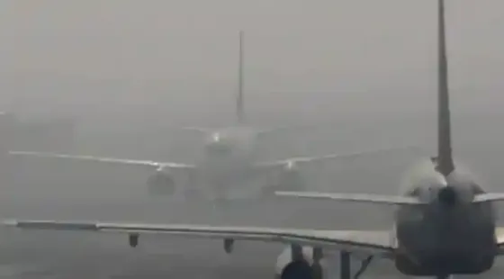 Dense fog and hazardous air pollution gripped Delhi, disrupting over 700 flights and pushing AQI near severe levels. A toxic mix of dense fog and hazardous air