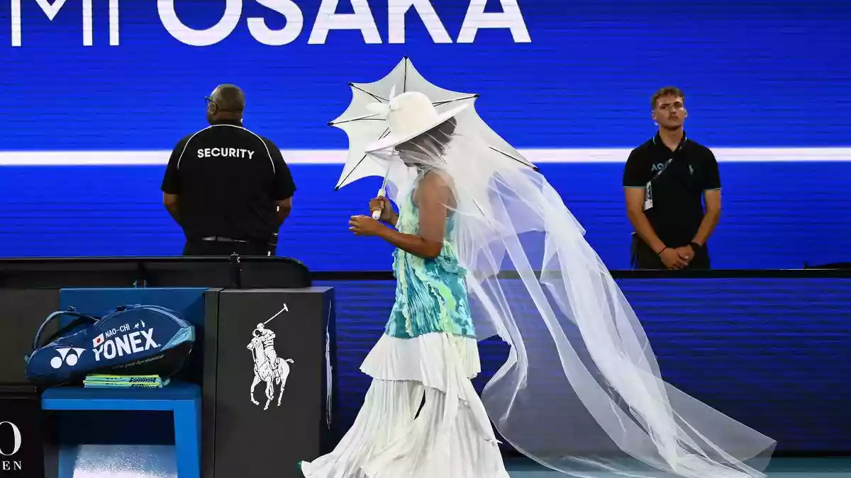 Twice Australian Open champion Naomi Osaka floated onto Rod ‍Laver Arena in a jellyfish-inspired outfit and ​claimed a see-sawing 6-3 3-6 6-4 win