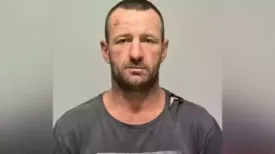A body found in New South Wales is thought to be that of a man wanted over the murder of three people in a small Australian town in January