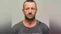 A body found in New South Wales is thought to be that of a man wanted over the murder of three people in a small Australian town in January