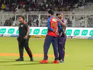 Kolkata Knight Riders and Punjab Kings shared a point each after their Indian Premier League match was abandoned due to rain. The match was stopped early with