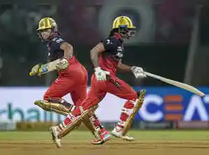 Shreyanka Patil's five-wicket haul powered Royal Challengers Bengaluru to a 32-run victory over Gujarat Giants. Patil credited a crucial century partnership